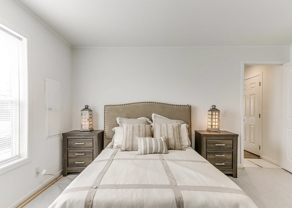 Modular home primary bedroom by Highland Manufacturing.