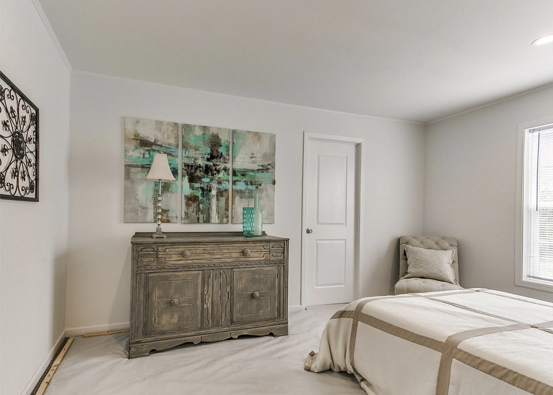 Modular home primary bedroom by Highland Manufacturing.